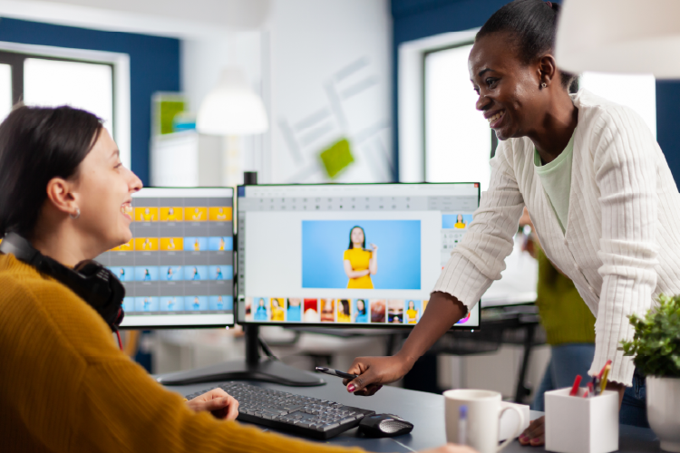 A two woman team designing a website